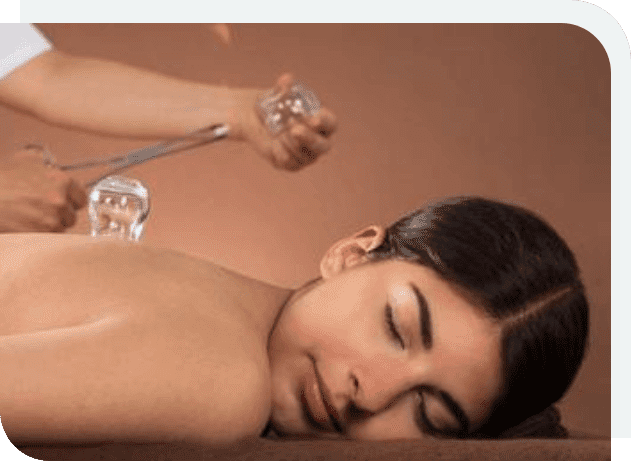 A woman is getting her back massage with cupping.